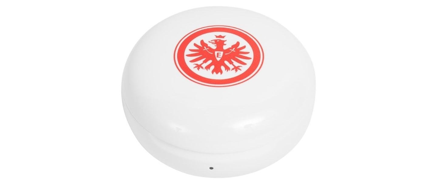 A closeup of the Eintracht Frankfurt TONE Free's charging case with the team's logo displayed on top