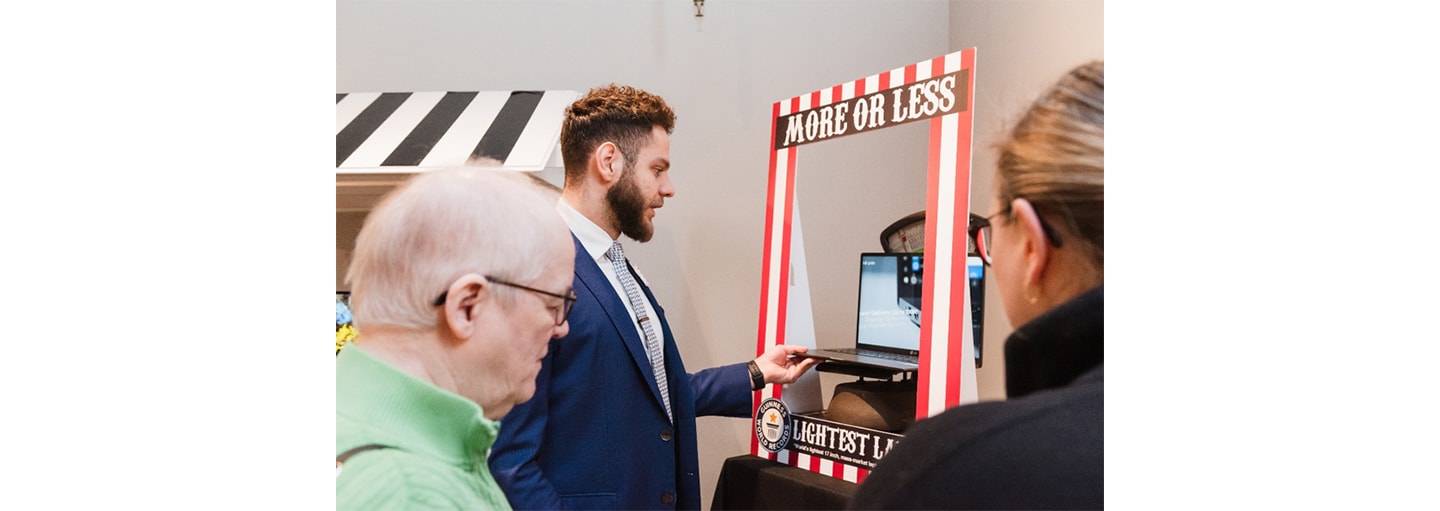 A man weighs the LG gram on the scale placed inside its ‘More or Less’ display