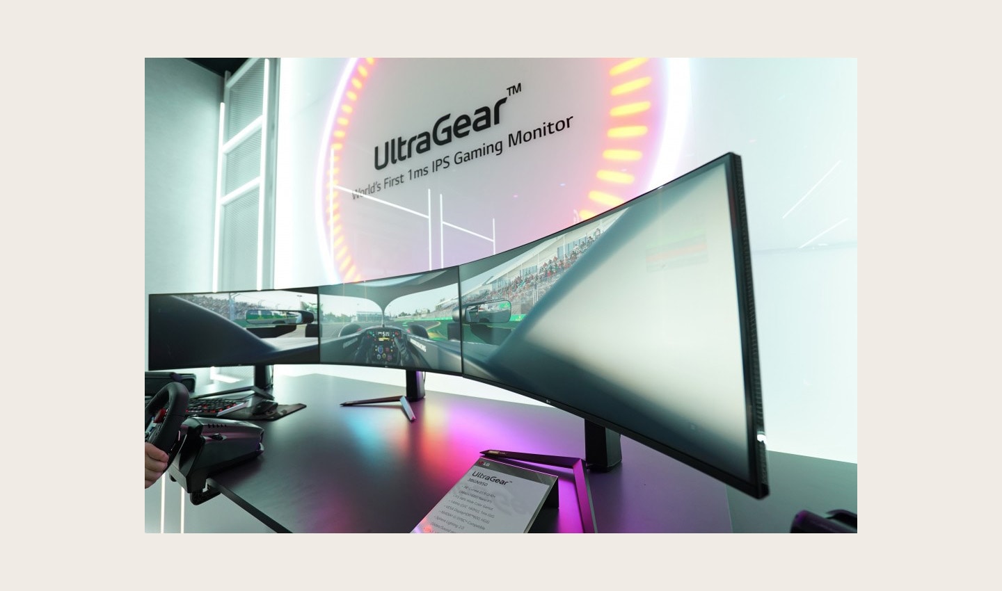 A closer look at three UltraGear monitors being used side-by-side to create one ultra-wide display to play a racing game at LG’s CES 2020 booth