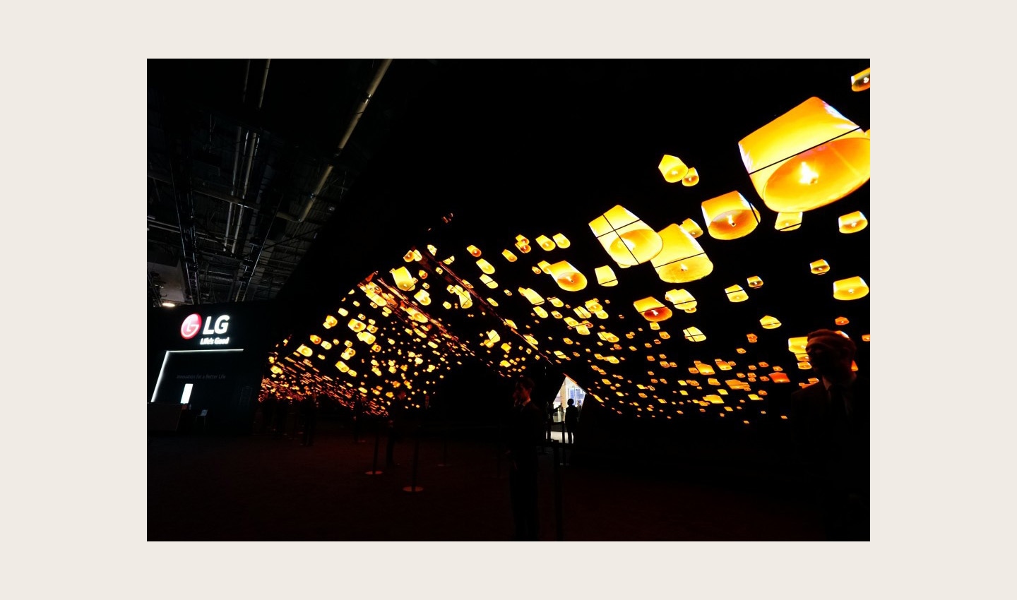 A wide-angle shot of LG Wave in the dark displaying hundreds of glowing lanterns rising into the night sky at CES 2020