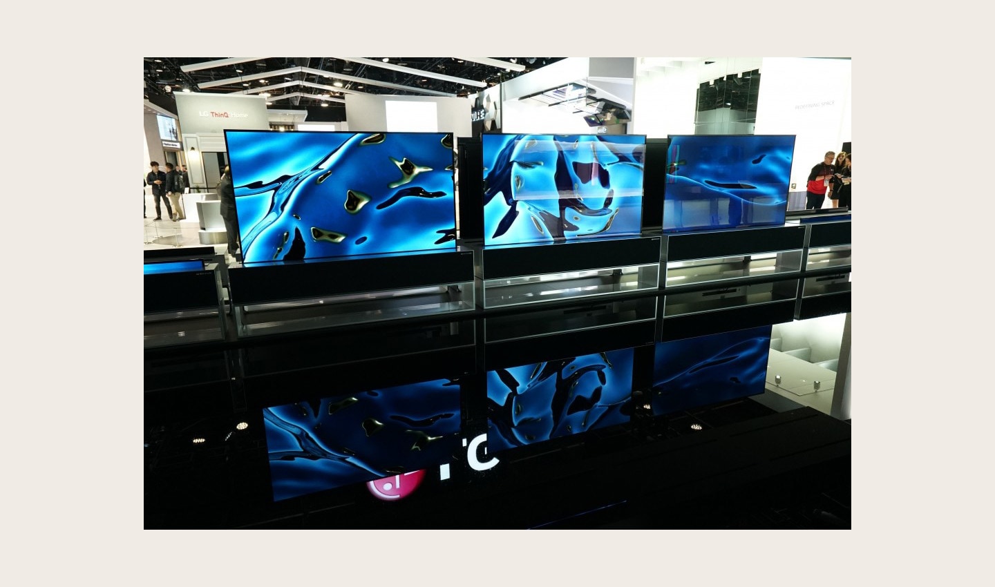 A closer look at three of the LG SIGNATURE Rollable TVs (R) being showcased in their full-view mode at the company’s CES 2020 booth