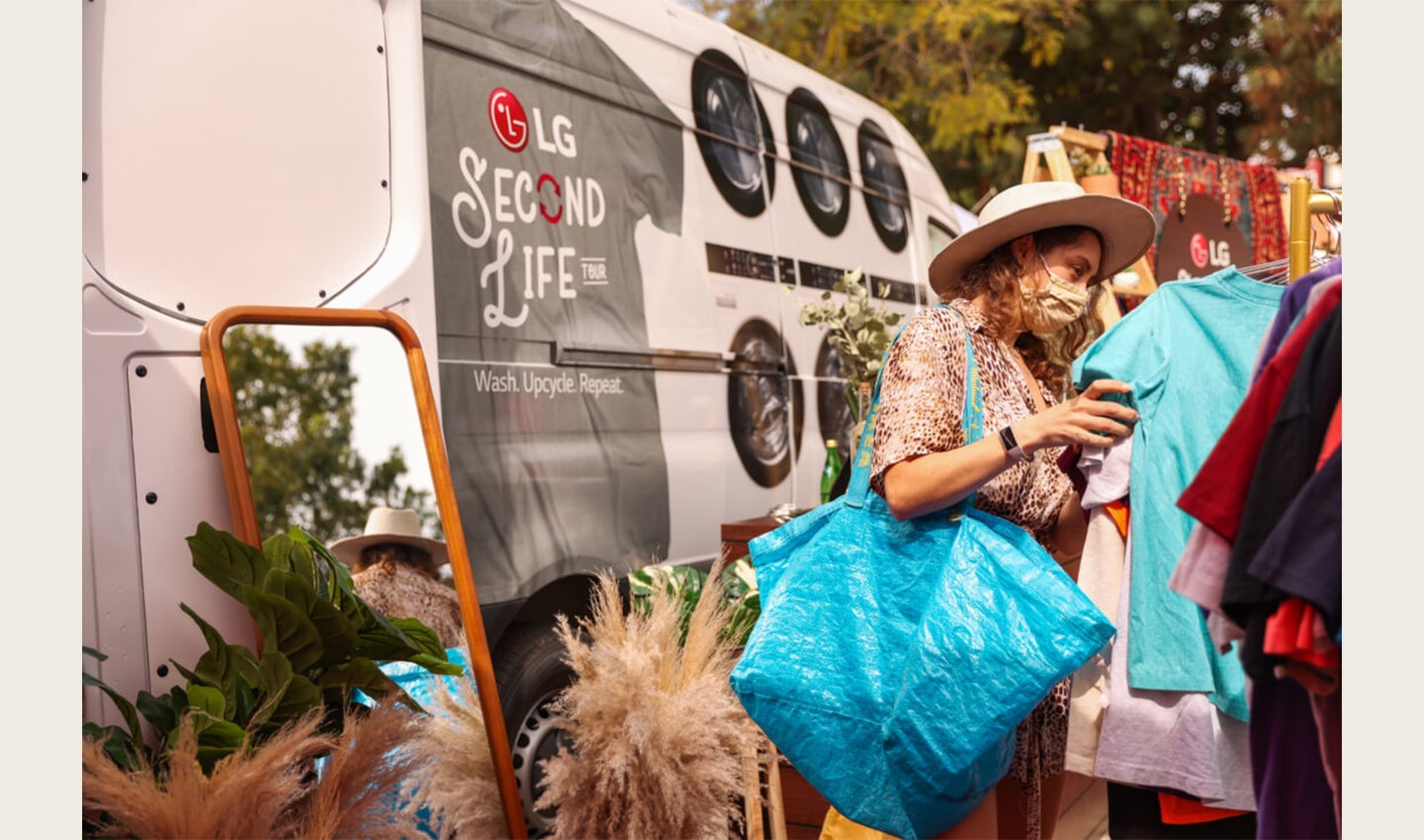 A woman looking through the clothes on display at The Second Life Campaign venue which is being hosted by LG Electronics