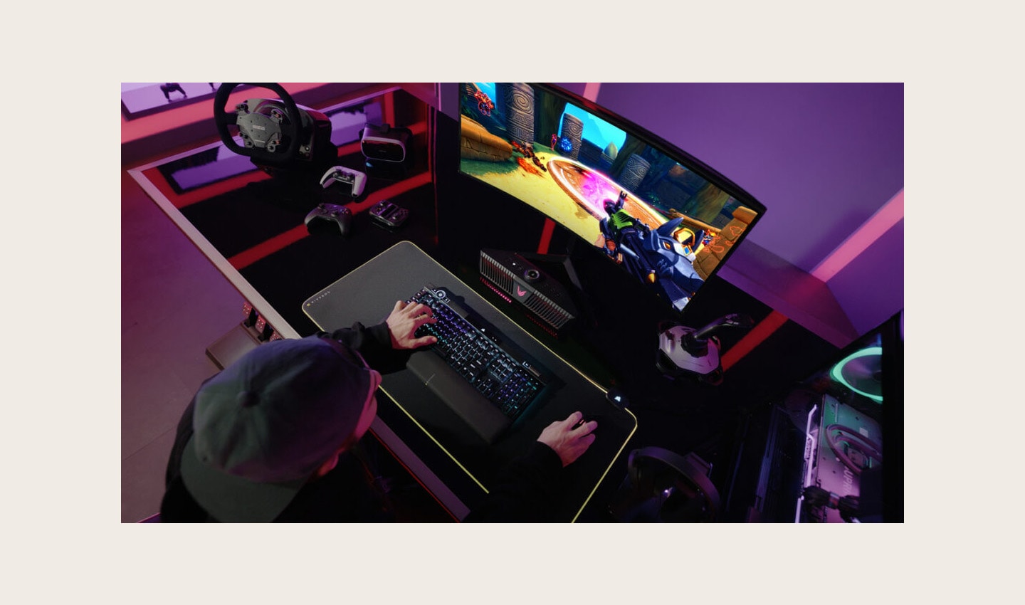 A gamer playing a game on an LG UltraGear gaming monitor connected to an LG UltraGear Gaming Speaker (model GP9)