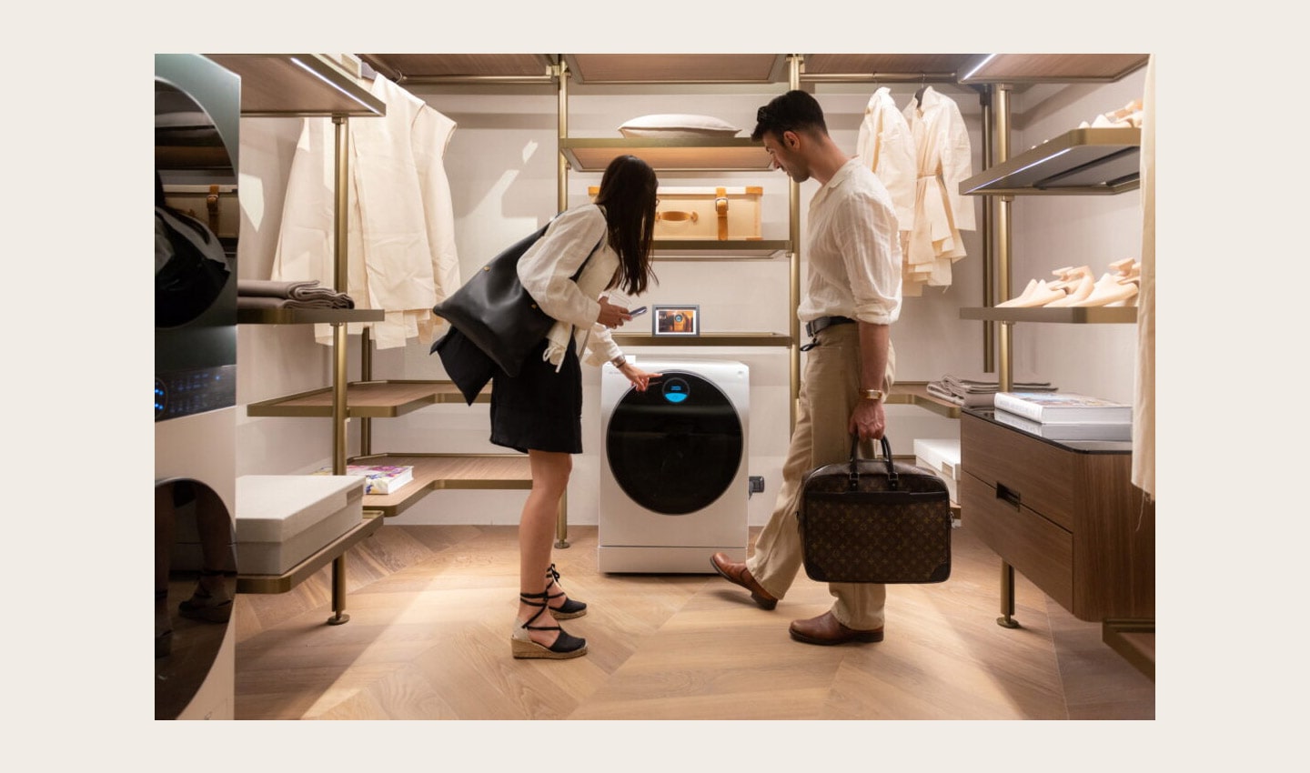 Two visitors taking a closer look at LG washer during Milan Design Week 2022
