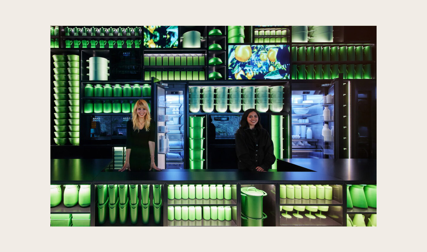 Staff standing beside the Signature Kitchen Suite refrigerators in the Signature Kitchen Suite showroom in Piazza Cavour, Milan, Italy