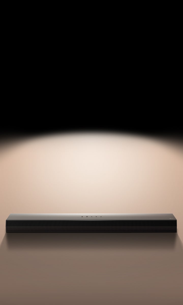 LG Soundbar against a black backdrop highlighted by a spotlight. 