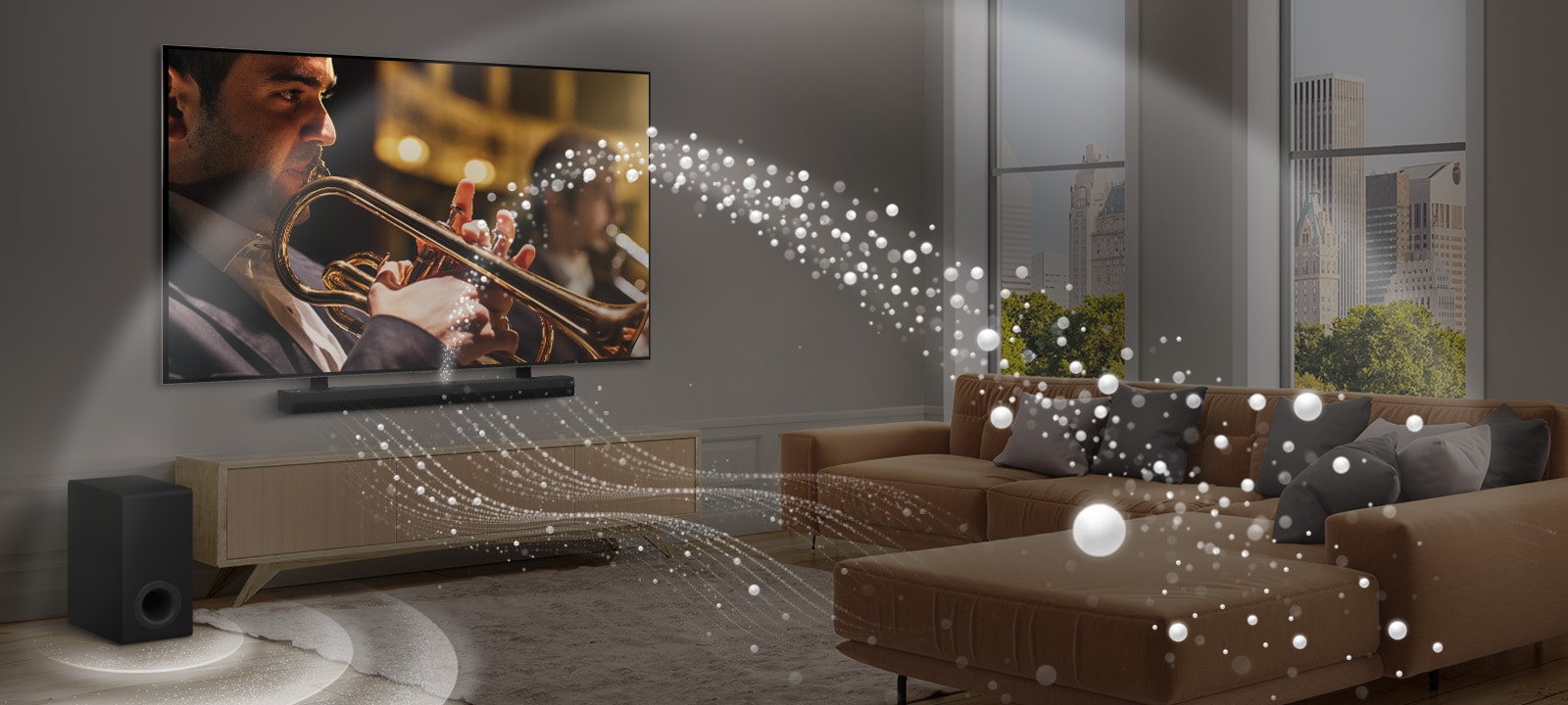 An LG Soundbar, LG TV, and subwoofer are in a modern city apartment. The LG Soundbar emits three branches of soundwaves, made of white droplets that float along the bottom of the floor. Next to the Soundbar is a subwoofer, creating a sound effect from the bottom. 