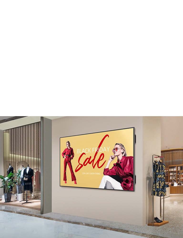 A large display is installed on a shopping mall’s interior wall, and the display’s screen is showing advertisements clearly and vibrantly.