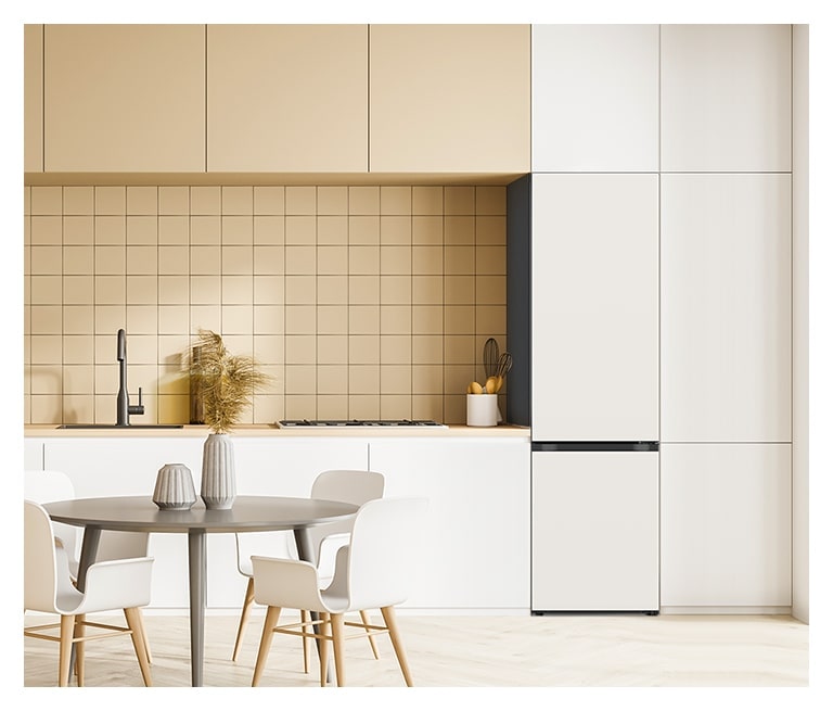 Beige tile backsplash, white cabinets, sleek refrigerator on right, round dining table with chairs, and modern faucet.