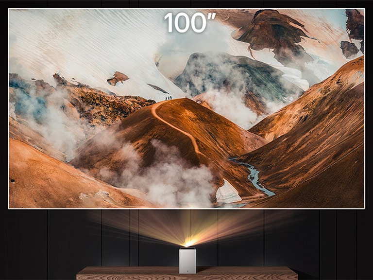 "LG CineBeam projecting a cloudy mountain image "