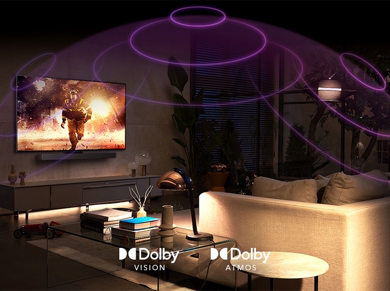 An image of an LG OLED TV in a room playing an action movie. Sound waves create a dome between the sofa and the TV, depicting immersive spatial audio.