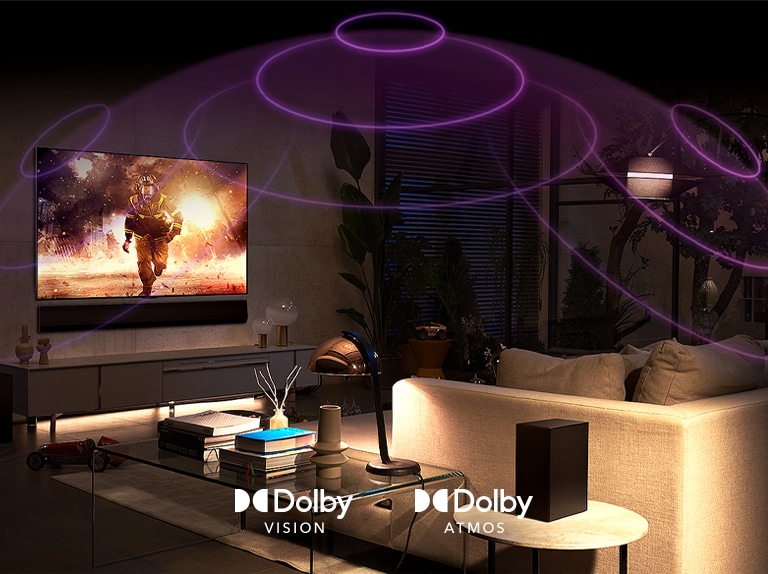 An image of an LG OLED TV in a room playing an action movie. Sound waves create a dome between the sofa and the TV, depicting immersive spatial audio.