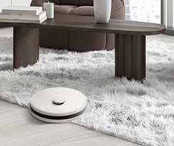Image of a robot vacuum cleaning the floor and carpet.