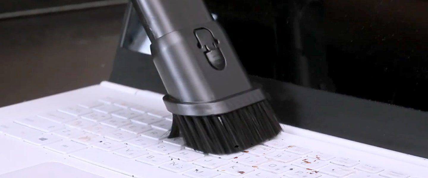 Image of using the Combination Tool to remove dust from a laptop