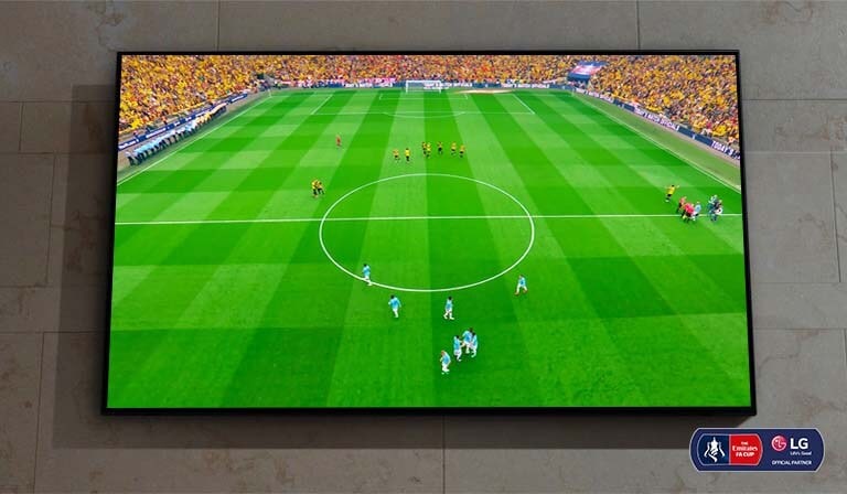 There is a wall-mounted Nanocell TV. There is a soccer match about to start on the screen.