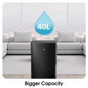 Bigger Capacity_The dehumidifier is located in a wide living room, enabling large-capacity dehumidification.
