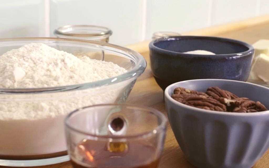 Pecans, maple syrup, flour and butter on the table ready to create pumpkin spiced cinnamon rolls in the LG NeoChef Countertop Microwave Oven