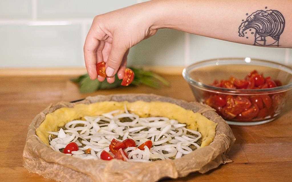 LG's vegan chef chops the tomatoes in preparation for a Tomato Quiche, all made in the NeoChef microwave | More at LG MAGAZINE