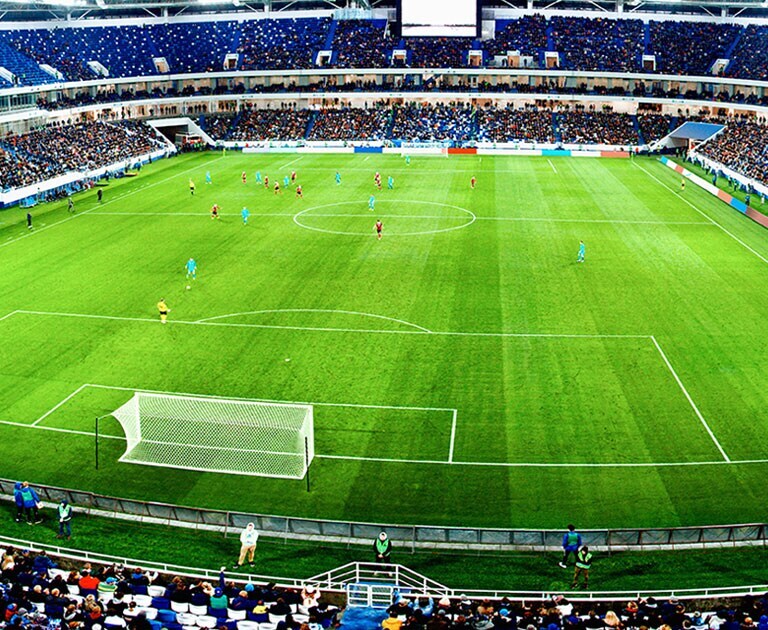 Gambaran tampak atas sebuah stadion dengan tombol Tautan