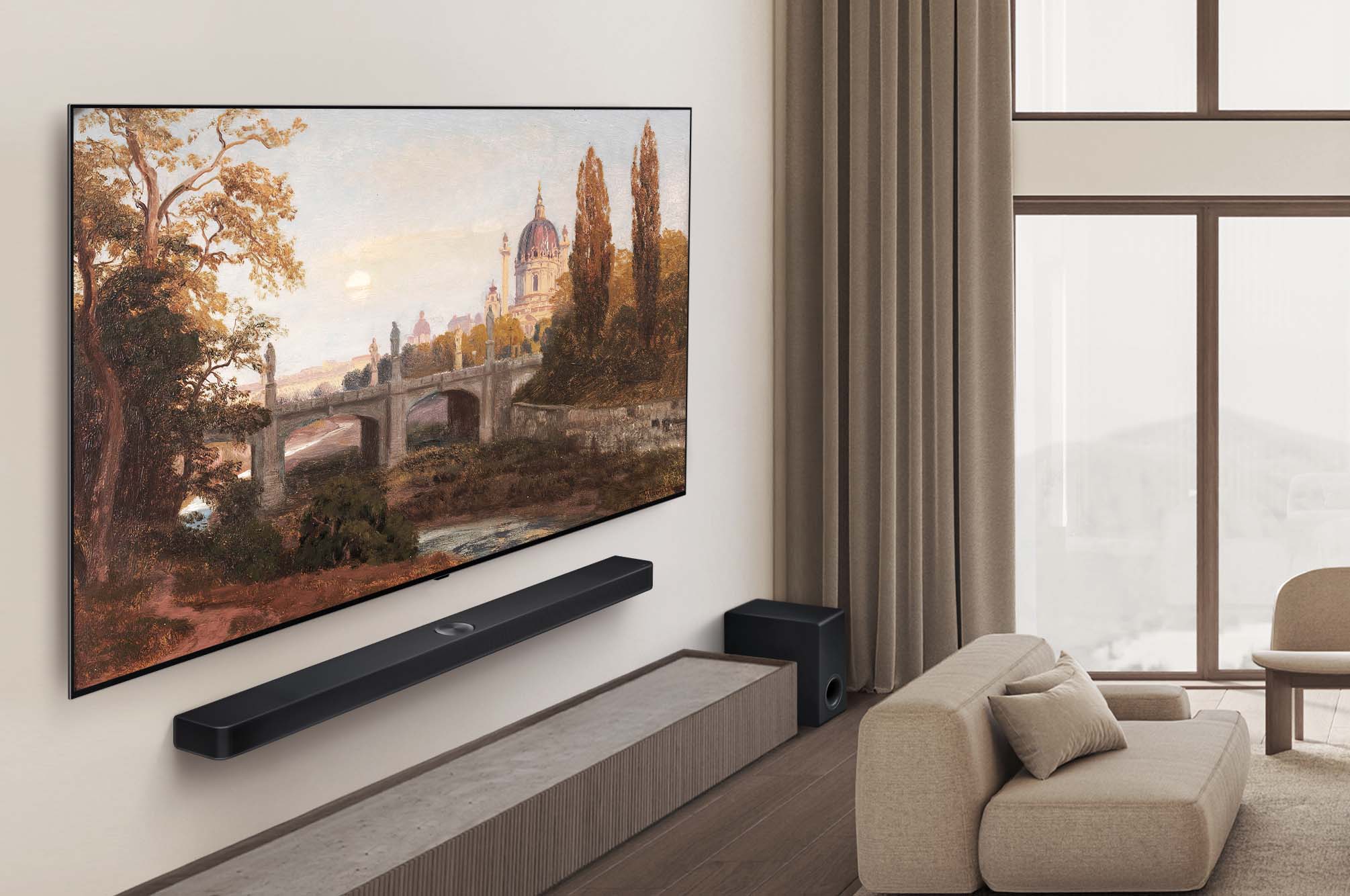 Wide view of a premium living room in muted earth tones. On the wall is an LG OLED AI B5 4K Smart TV with an artwork on its screen. An LG Soundbar is mounted underneath it.