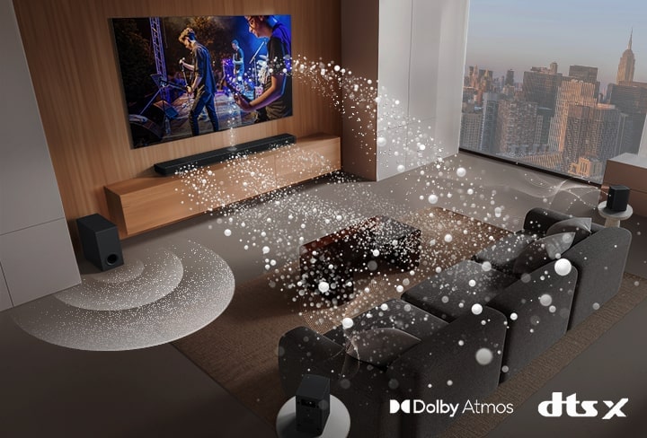 LG Soundbar, LG TV, rear speakers and a subwoofer are in a living room of a skyscraper, playing a musical performance. White soundwaves made up of droplets project from the soundbar, looping around the sofa. A subwoofer is creating a sound effect from the bottom. Dolby Atmos logo DTS X logo
