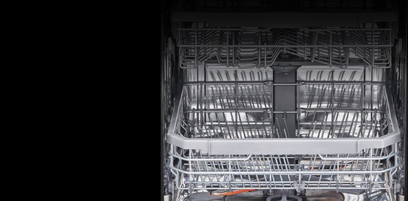 The stainless steel interior of the dishwasher.