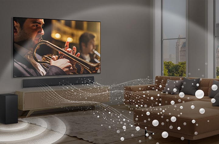 Soundbar, TV LG e subwoofer sono collocati in un moderno appartamento di città. La LG Soundbar emette onde sonore composte da goccioline bianche che riempiono la stanza e un subwoofer crea un effetto sonoro dal basso. Nel complesso, creano un effetto a cupola in tutta la stanza.