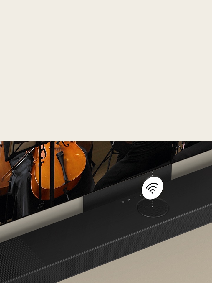 Un TV OLED LG e una soundbar montati sulla parete con il simbolo Wi-Fi bianco al centro.