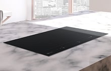 Immagine di una cucina con un piano cottura installato