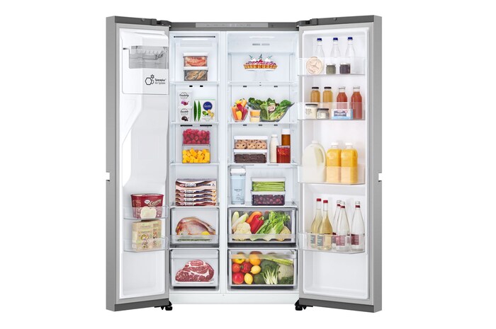 Frigorifero aperto completamente pieno di alimenti