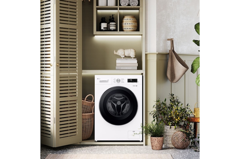 Cassetto del detersivo aperto con lavatrice vista dall'alto