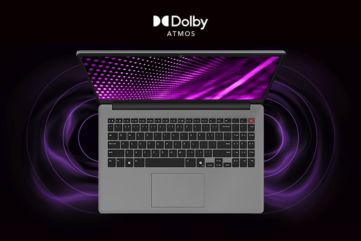 L'immagine mostra una vista dall'alto di un computer portatile grigio con una grafica vivace a tema viola sullo schermo. Intorno al portatile sono presenti immagini di onde sonore dinamiche, che indicano un'esperienza audio coinvolgente. Il logo “Dolby Atmos” è visualizzato nell'angolo in basso a destra.