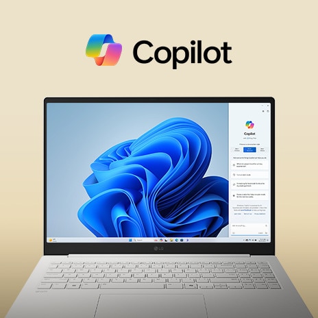 Un computer portatile con il logo di Windows Copilot sopra lo schermo e l’interfaccia di Windows Copilot sul display, che sfoggia un design elegante con un ampio schermo e l’interfaccia di Windows 11 sullo sfondo.