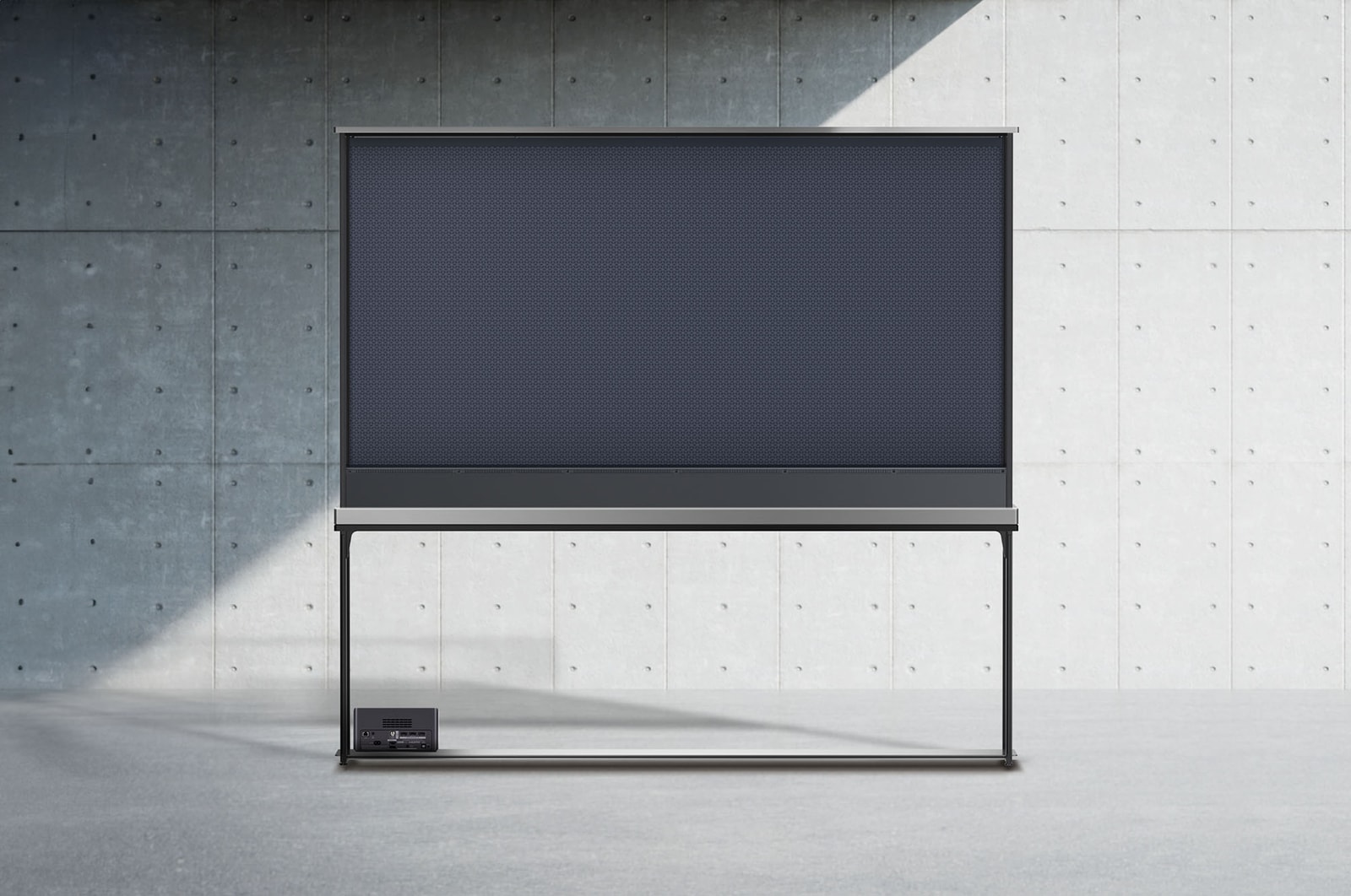 Rear view of LG SIGNATURE OLED T with the shade drawn up to show the black backdrop and the back of a Zero Connect Box.