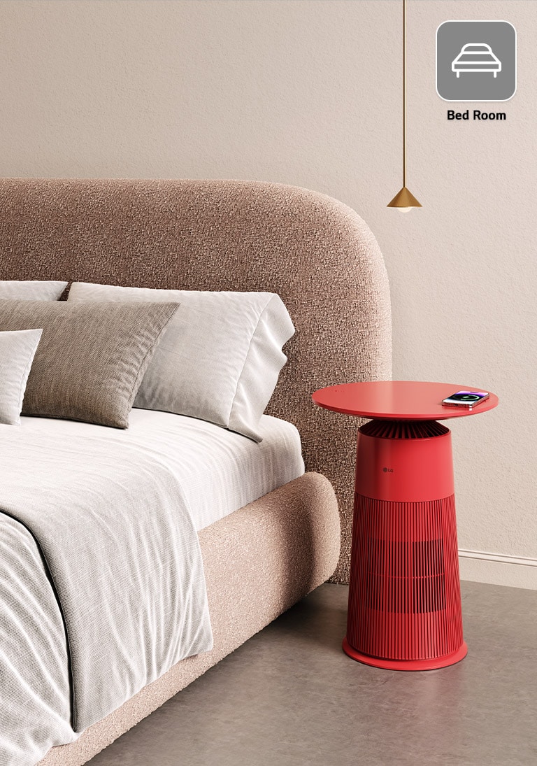 There is a product that stands out in red between the sofa and the table. It is becoming a sensuous point for the interior of the living room.