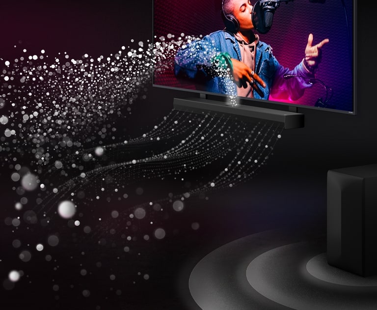 LG Soundbar and LG TV in a black room playing a musical performance. White droplets representing soundwaves shoot upwards and forward from the soundbar. A subwoofer is creating a sound effect from the bottom.