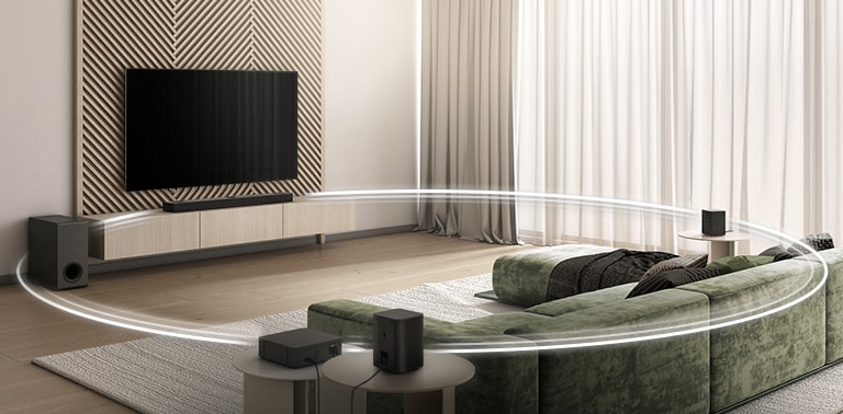 There is TV displays two cellos on the screen, a sound bar, a subwoofer, and 2 rear speakers in a wide living room. A circle graphic connects LG Sound Bar, Sub-woofer, and 2 rear speakers.