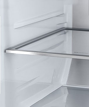 A diagonal view of the shelf with metallic paneling on the interior of the refrigerator.