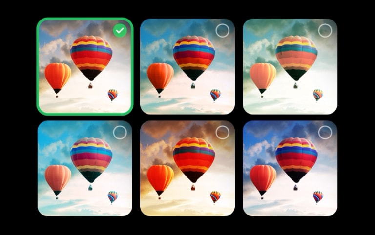 A video shows a gallery featuring 6 images of hot air balloons in the sky with differing contrast, brightness, color, etc. Two images are selected. Next, a gallery featuring 6 images of people blowing bubbles appears. 2 more are selected. A black screen appears with a pink and purple loading icon. An image of a mystical landscape appears, and refinements appear gradually from left to right, revealing the ideal imagery.