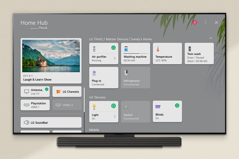 An image of a remote control pointed at an LG OLED TV showing soundbar control settings on the right side of the screen.