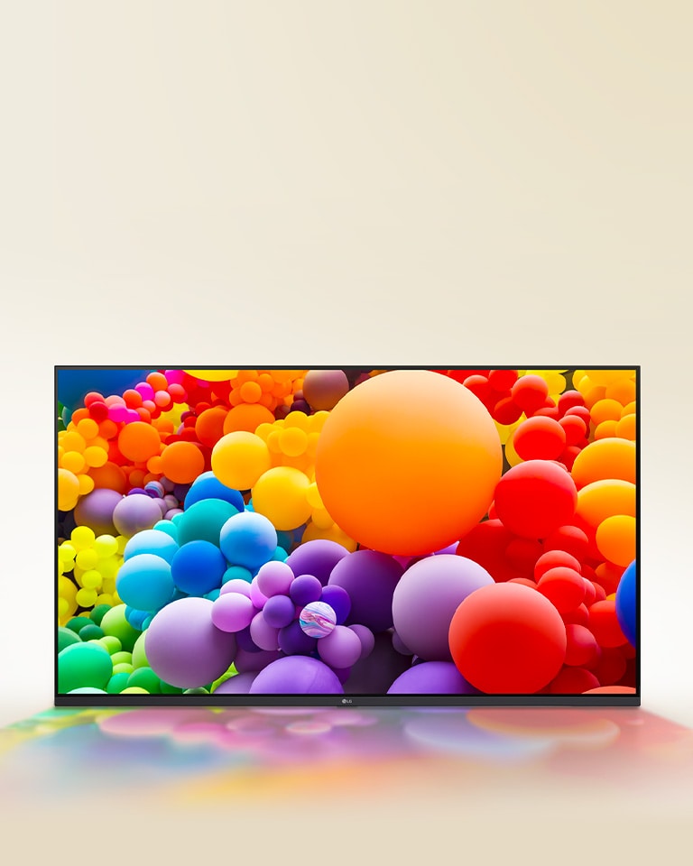 A room filled with vibrant colors, with circle shapes, and spiraling circles on the wall are displayed on LG UHD TV.