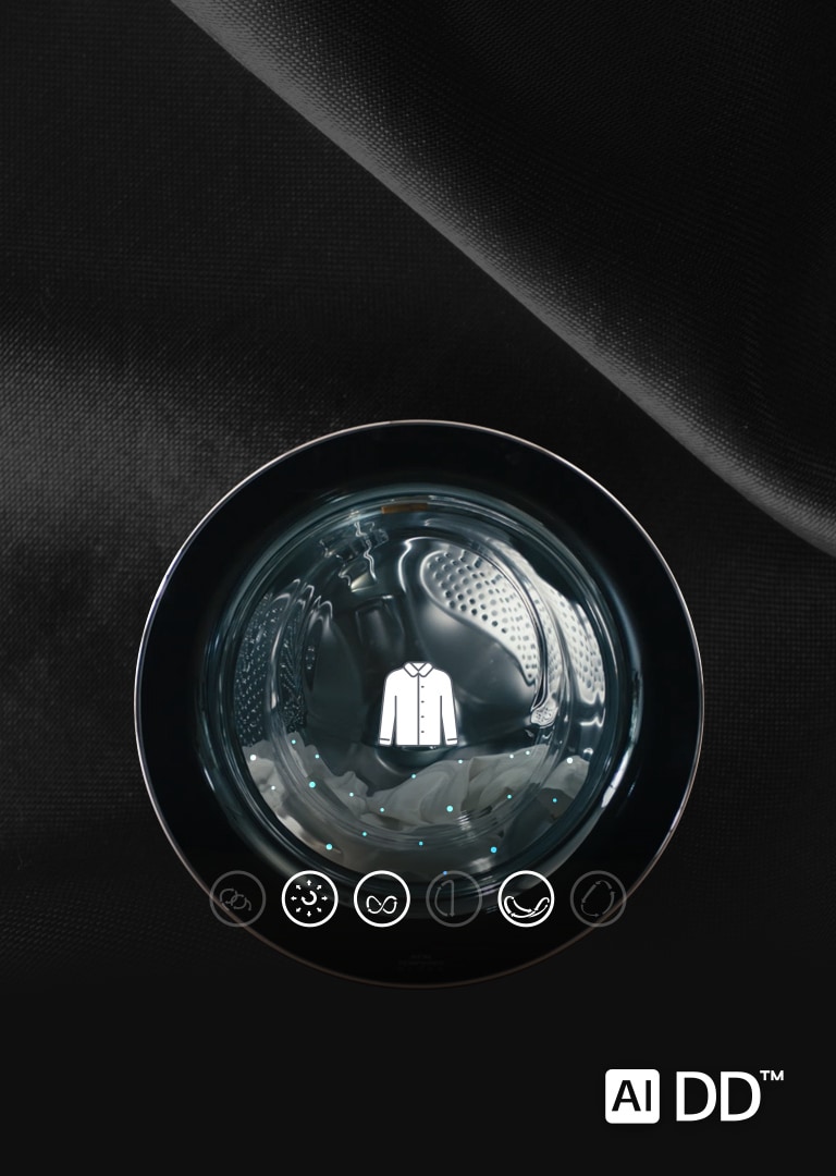 There is a washing machine door. There is a laundry inside the door and a shirt icon above it.