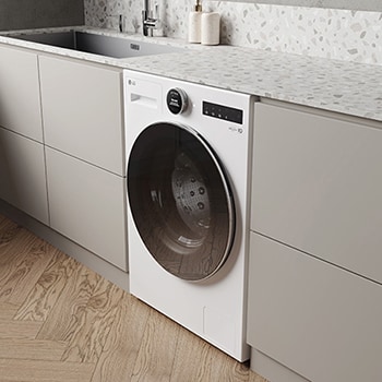 De witte LG 9 kg wasmachine F4WX801Y, geïnstalleerd in een moderne keuken om het strakke, geïntegreerde ontwerp te benadrukken.