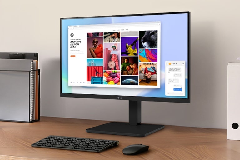 Een werkruimte op een bureau met een monitor en documenthouder.