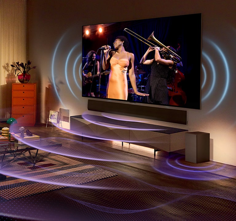 Een beeld van een LG OLED TV in een kamer met een muziekconcert. Blauwe gebogen lijnen die tv-geluid uitbeelden en paarse gebogen lijnen die Soundbar-geluid uitdrukken vullen de ruimte.