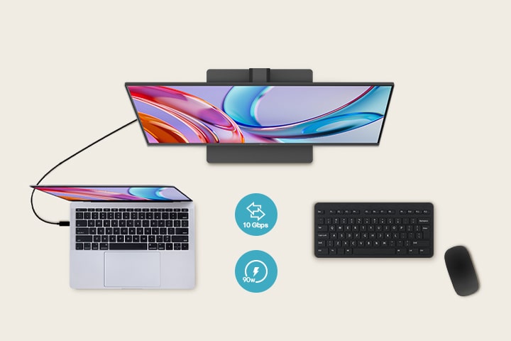 Bovenaanzicht van een monitor die is aangesloten op een laptop, met daaronder een toetsenbord en muis.