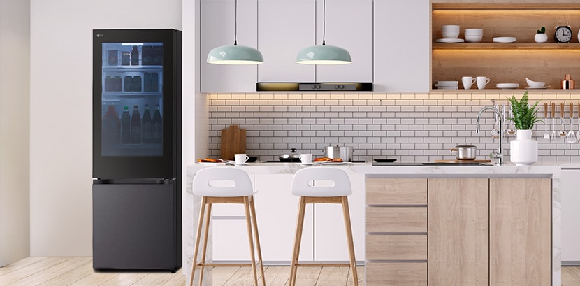 The overall view of  lg bottom freezer refrigerator with instaview in a kitchen.