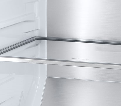 A diagonal view of the shelf with metallic paneling on the interior of the refrigerator.