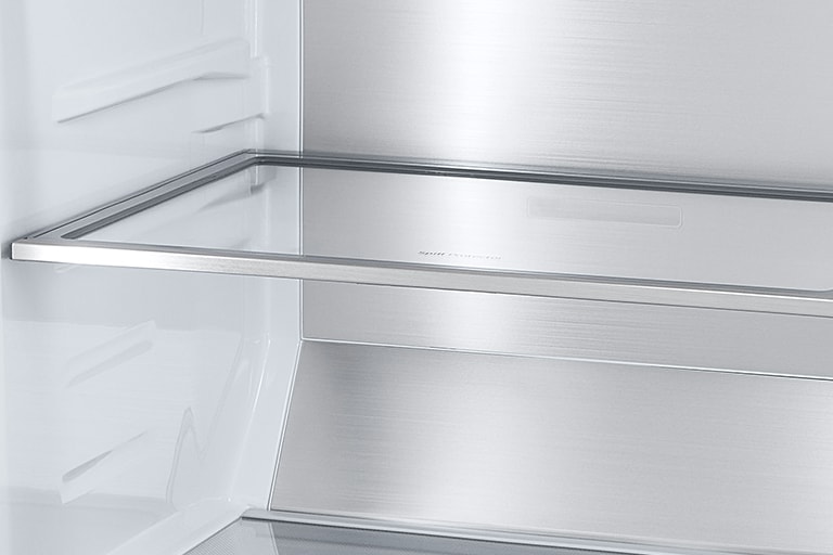 A diagonal view of the shelf with metallic paneling on the interior of the refrigerator.