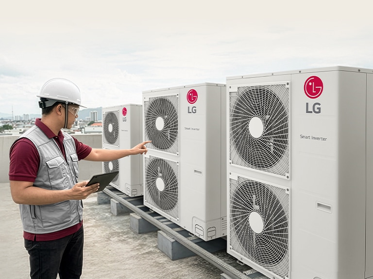 A technician is wearing safety gear, including a yellow hard hat, protective goggles, and ear protectors. He is holding a tablet and looking upwards, inspecting a project, with a stylized background featuring an abstract cityscape.